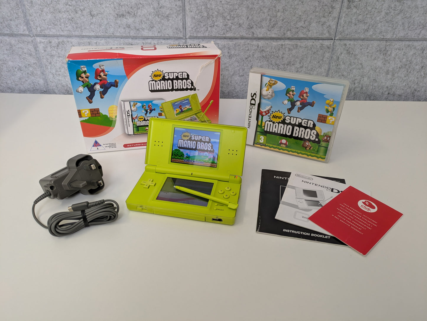 Nintendo DS Lite - Lime Green - PAL Variant - New Super Mario Bros. Bundle - Official Licensed Nintendo Refurbished Product - Used