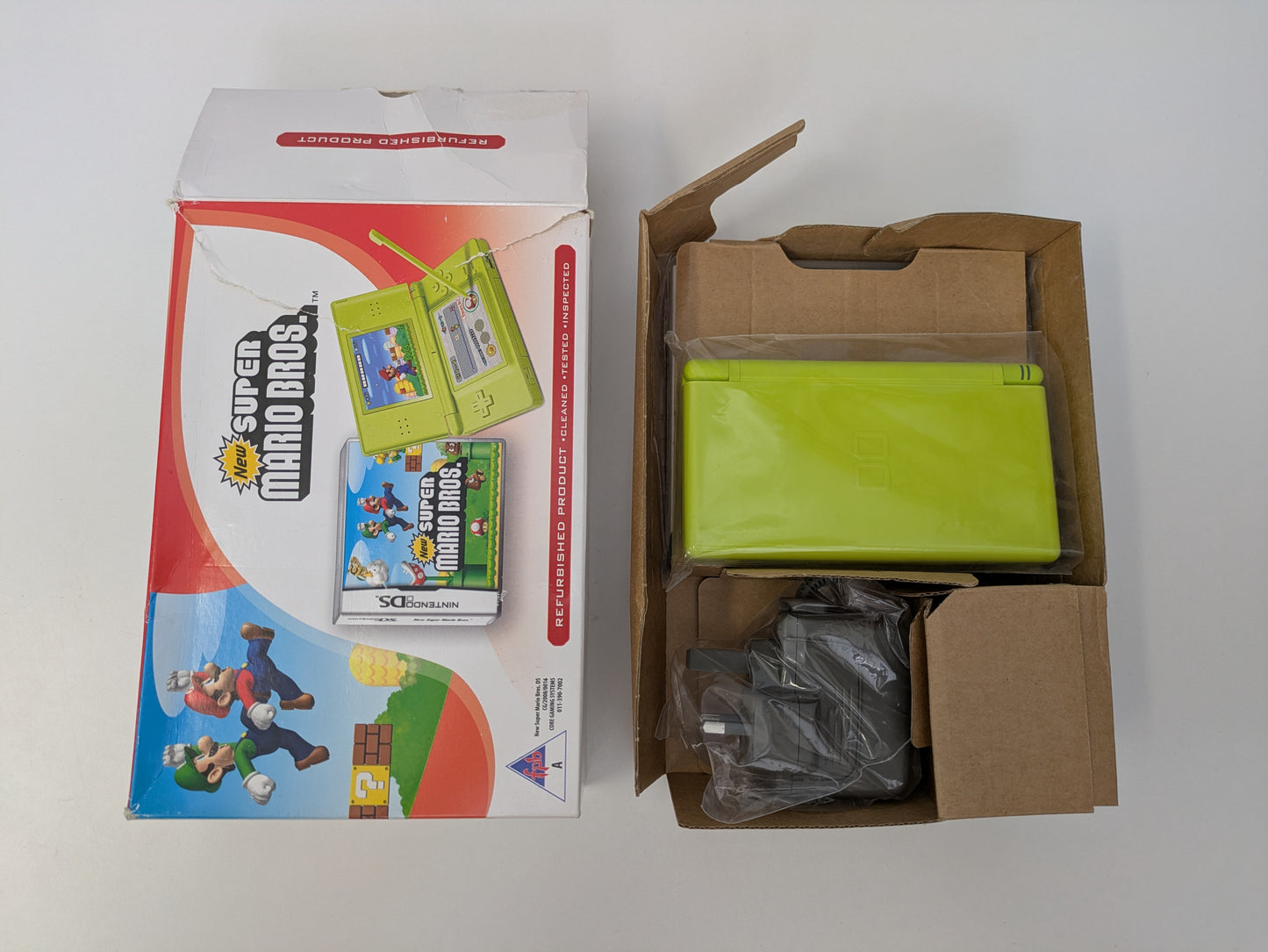 Nintendo DS Lite - Lime Green - PAL Variant - New Super Mario Bros. Bundle - Official Licensed Nintendo Refurbished Product - Used