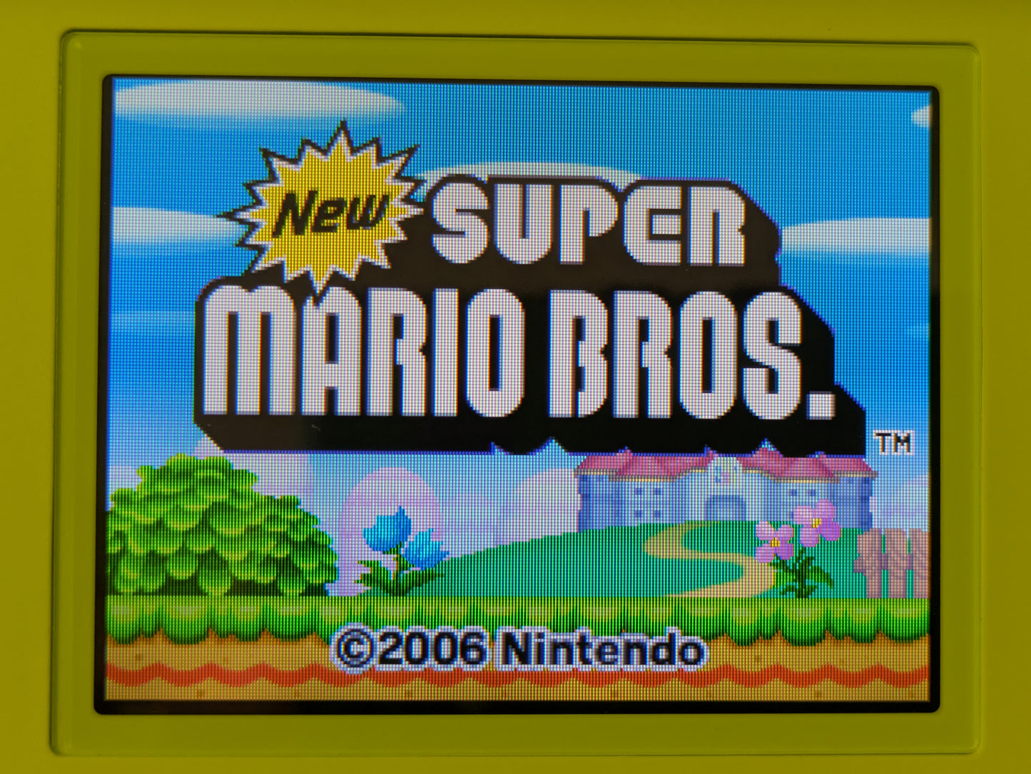 Nintendo DS Lite - Lime Green - PAL Variant - New Super Mario Bros. Bundle - Official Licensed Nintendo Refurbished Product - Used